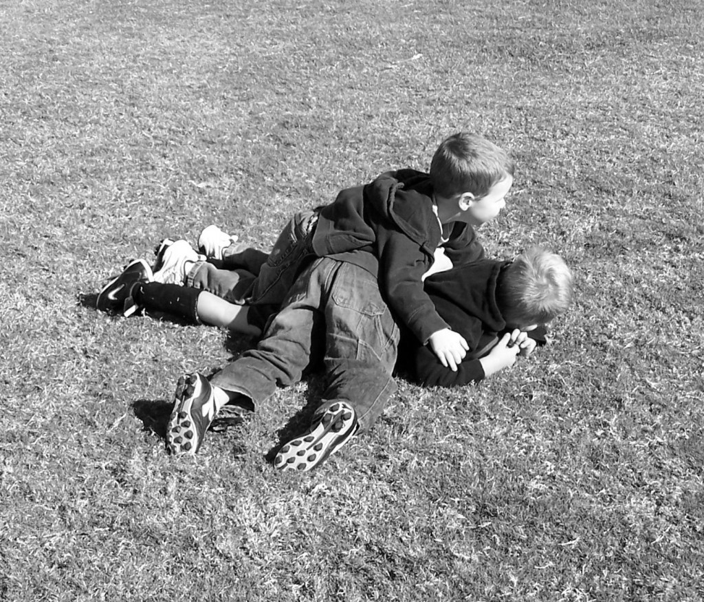 My friends tackled me as I tried to escape my big sister and her attempt to kidnap me.